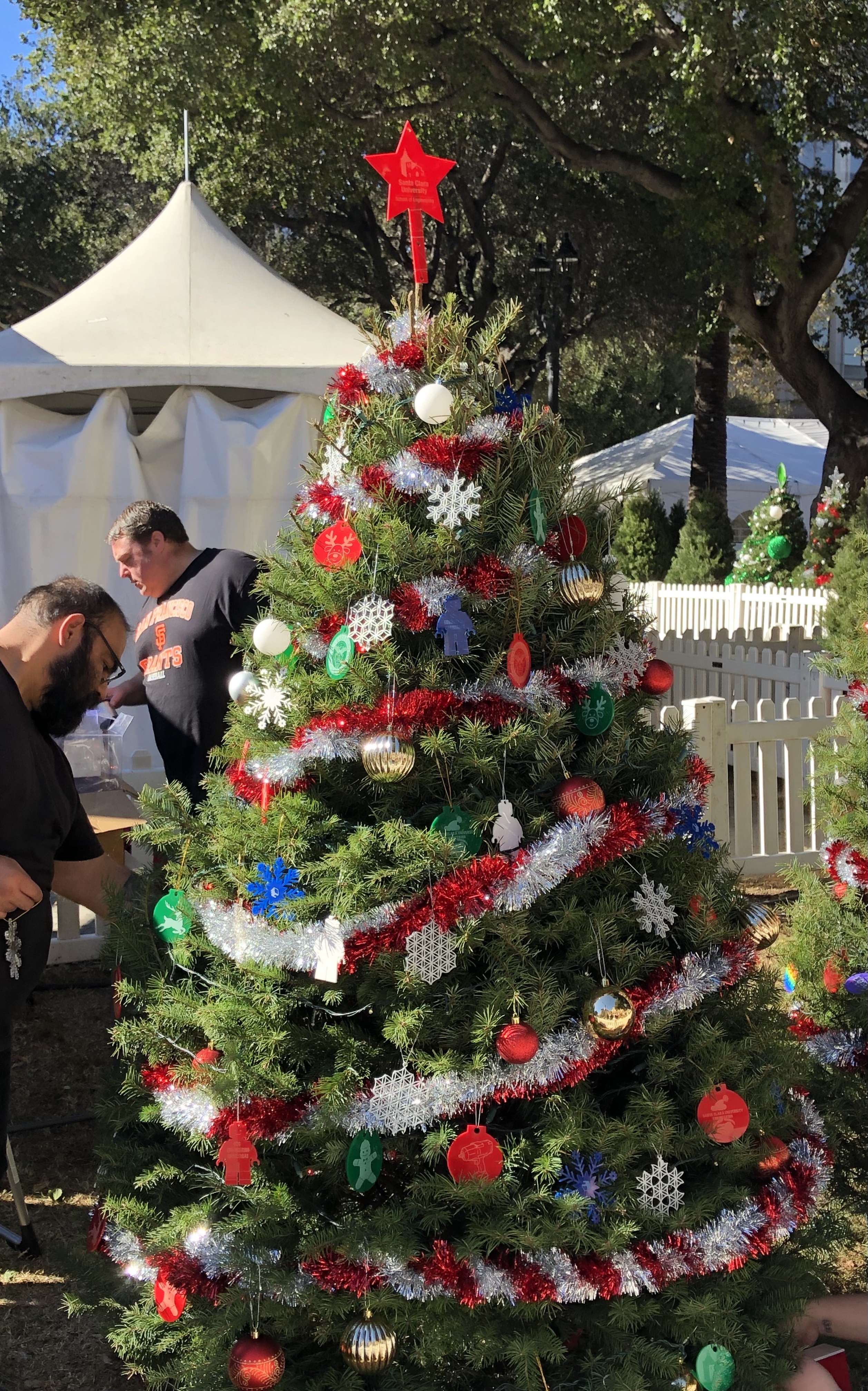 Photo of a Christmas tree with laser cut and 3D printed ornaments made by Maker Club members.