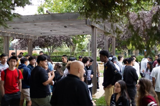 Large gathering at an outside picnic area for the Fall 2023 Theta Tau Recruitment.