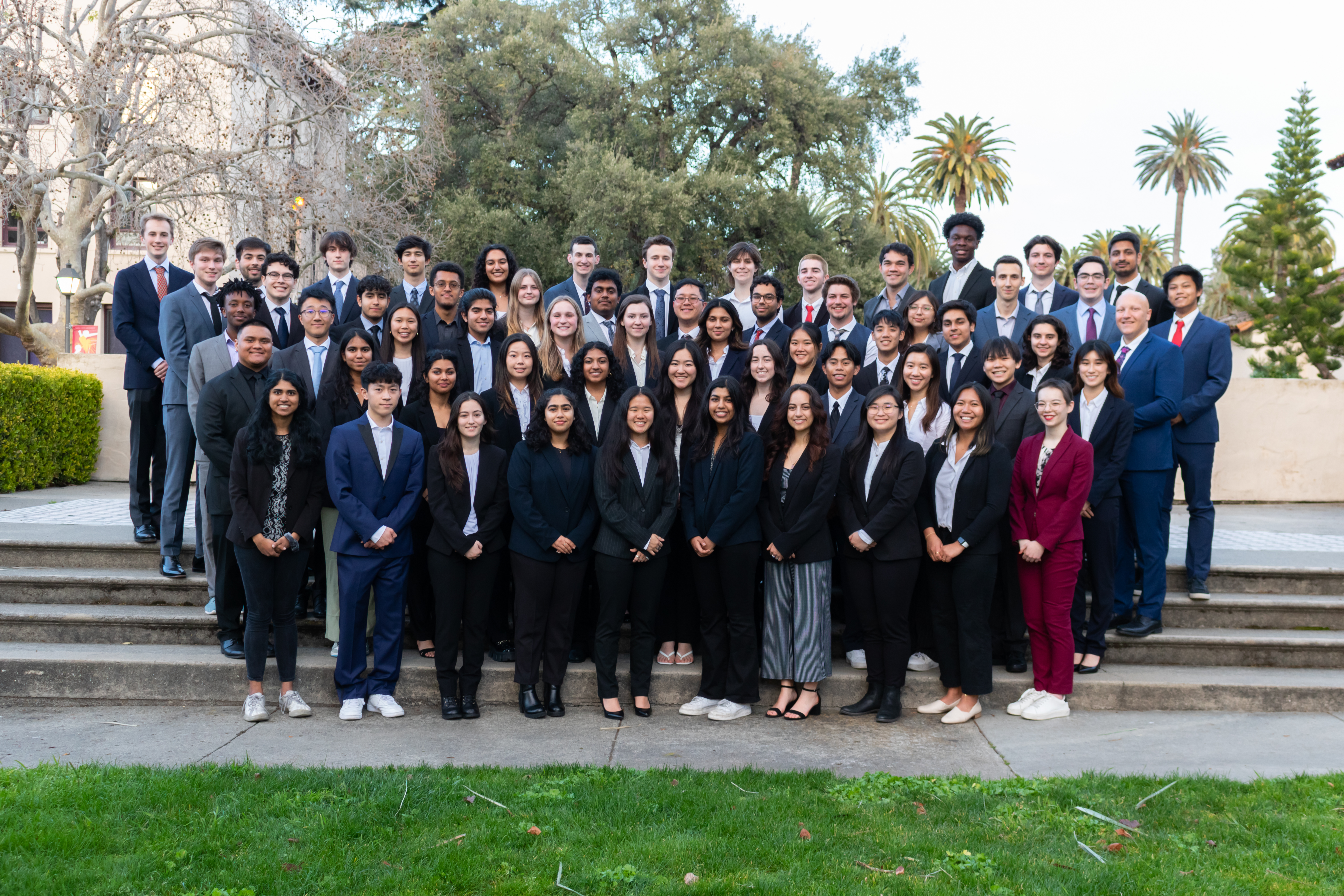 Group photo of Theta Tau members in professional attire.