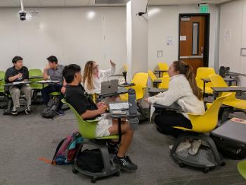 Students engaged in a mock negotiation