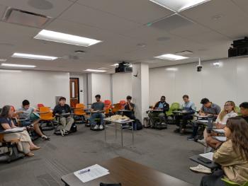 Students sitting in a circle in a classroom
