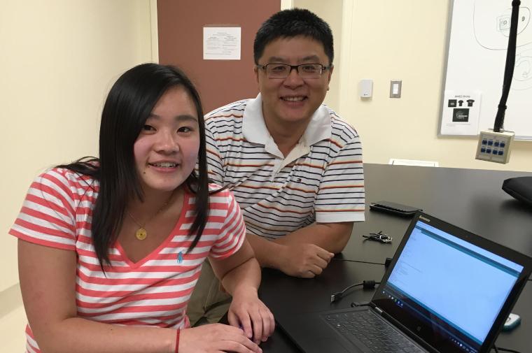 Casey Kiyohara ‘17 and Jonathan Zhang demonstrate the top performing noninvasive  glucose monitors in the Bioengineering Device Lab. image link to story
