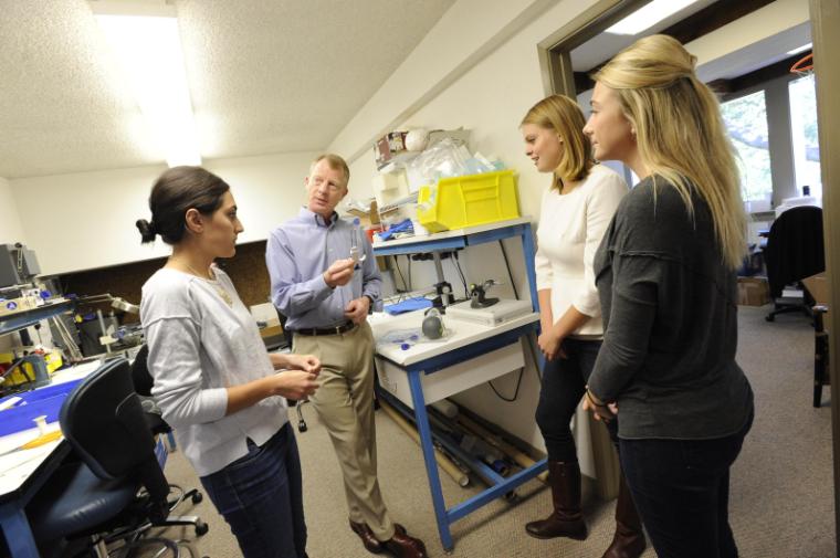 A bioengineering senior design team meets with their industry mentor.